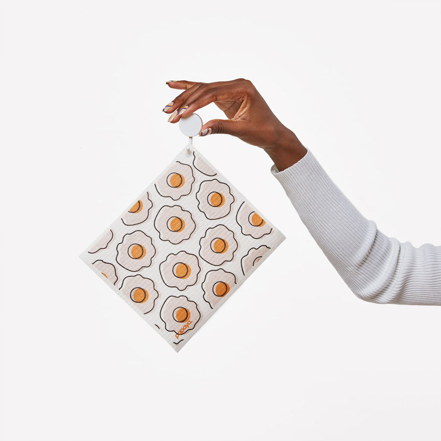 Model holding hook with reusable paper towel hanging with cute white and orange egg design